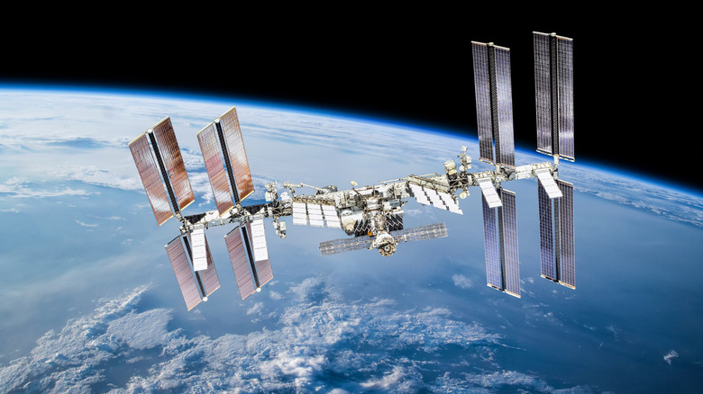 The International Space Station floats above the Earth