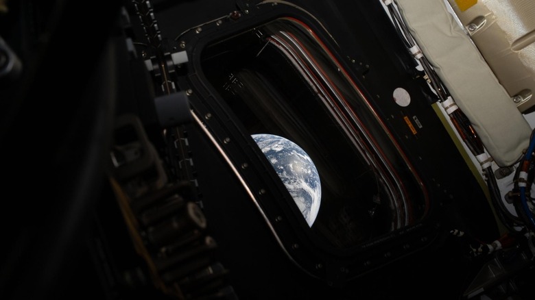 A view of Earth taken by NASA astronaut and Artemis II commander Reid Wiseman from one of the Orion spacecraft's four main windows after completing the translunar injection burn on April 2, 2026.