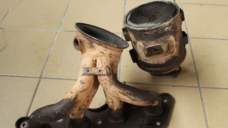 A clogged exhaust manifold and catalytic converter on the shop floor