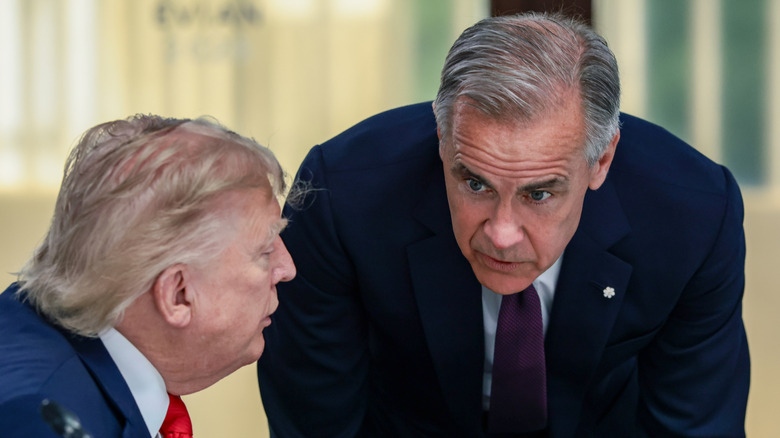 U.S. President Donald Trump speaks with Canadian Prime Minister Mark Carney at a working lunch with leaders of G7 and the Middle East, on June 16, 2026 in Evian-les-Bains, France