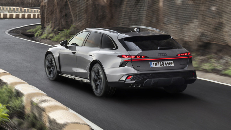 Rear 3/4 view of a grey Audi A6 Allroad driving