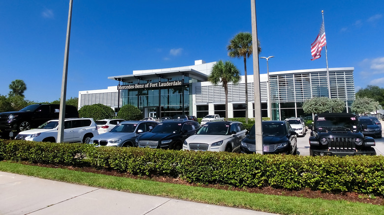 Fort Lauderdale, Florida, US - May 08, 2022: Mercedes Benz building car sign store dealership entrance shop logo