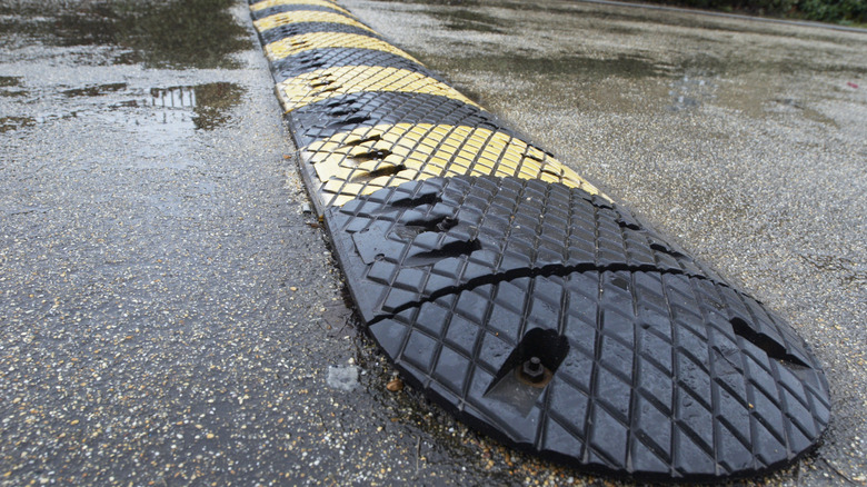 Close up image of a small speed bump installed in an intersection