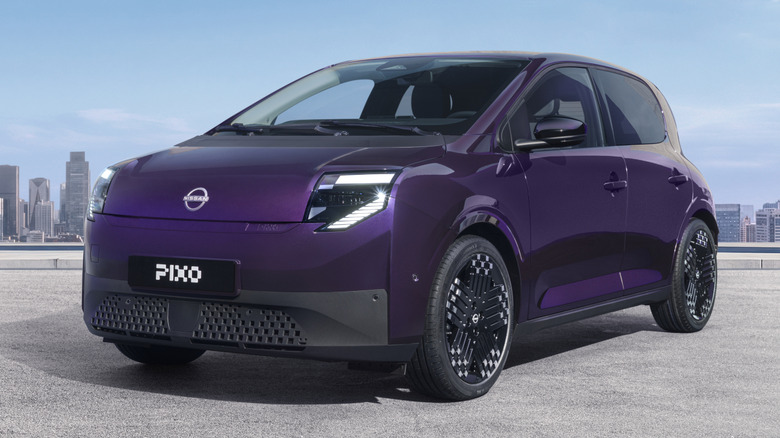 Front 3/4 view of a purple Nissan Pixo