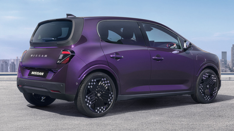 Rear 3/4 view of a purple Nissan Pixo