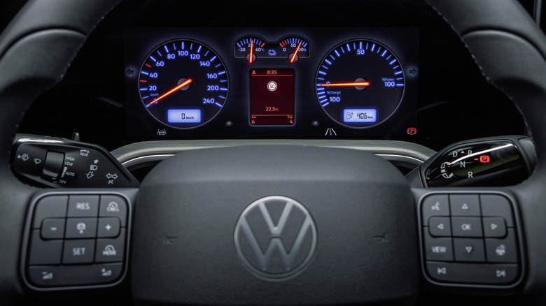 A close-up of the Volkswagen ID Tiguan's black steering wheel (with real buttons!) and the new Mk. IV Golf gauge design
