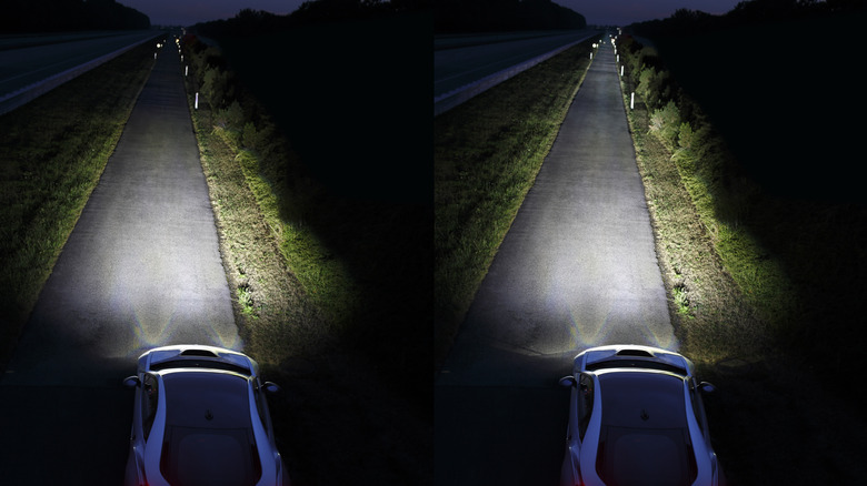 A side-by-side overhead shot of a white i8 parked on a rural road at night showing the difference between LED headlights on the left and laser headlights on the right, illuminating way further down the road