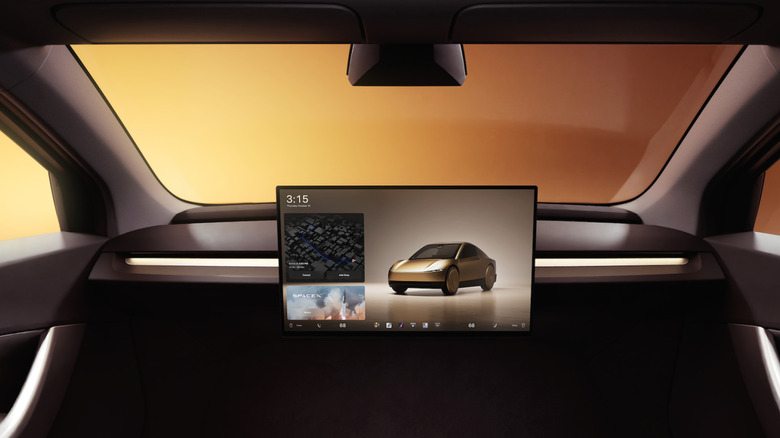 The control-free dashboard in the Tesla Cybercab with a tan background visible through the windshield