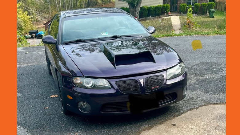 Purple GTO with large hood scoop