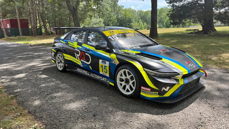 Black, green, and blue Hyundai Elantra N race car