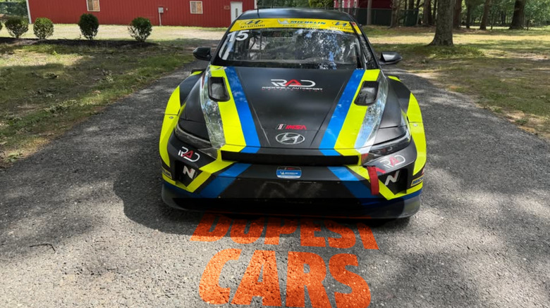 Black, yellow, and blue Hyundai race car from the front