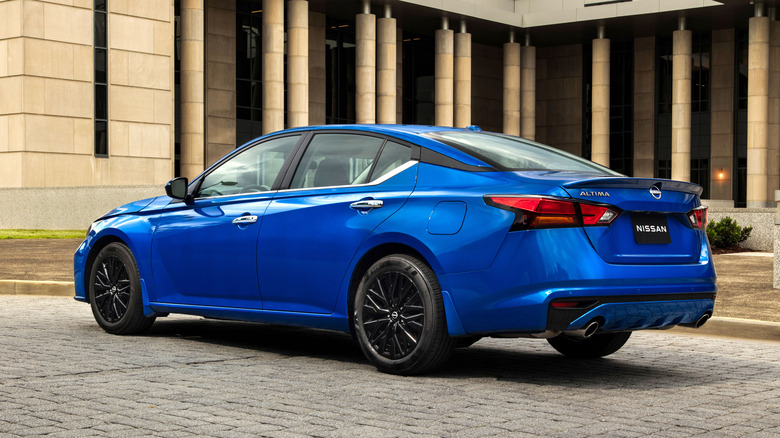 Rear 3/4 view of a blue 2025 Nissan Altima.