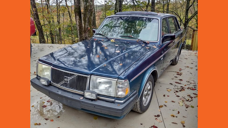 A blue Volvo 244 sedan