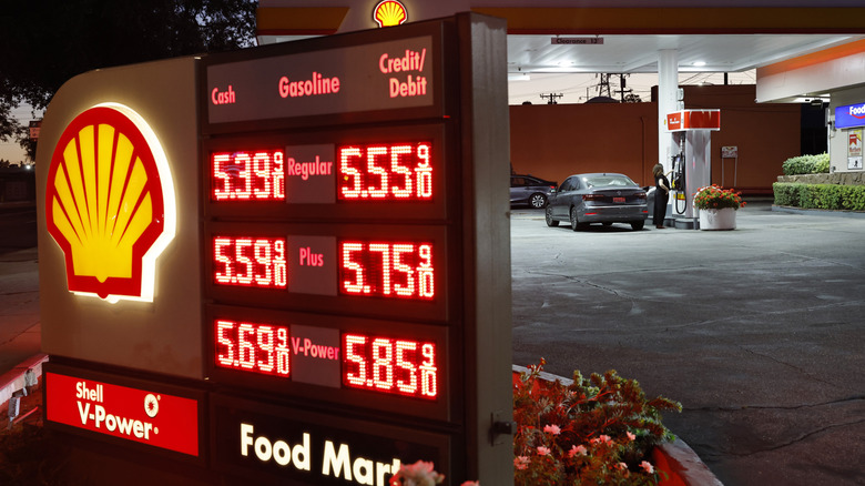 A customer stands near gas prices displayed at a gas station on July 7, 2026 in Pasadena, California.
