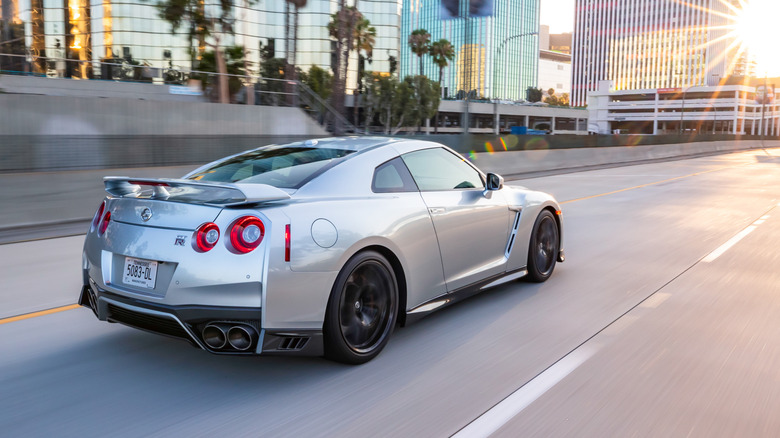 Nissan GT-R driving into the sunset