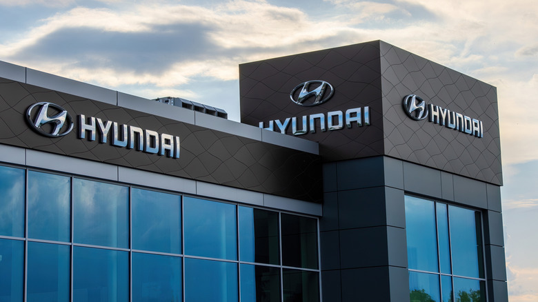 Hyundai company logo. Korean car manufacturer sign, Hyundai logo sign in showroom front, Warsaw, Poland - May 31, 2024