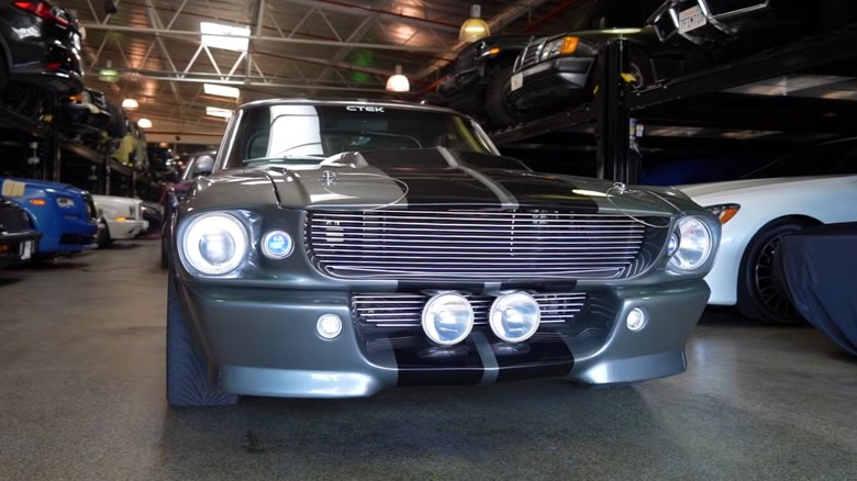 One of the three functioning Eleanor cars built for "Gone in 60 Seconds," pictured in a garage with many other cars in the background