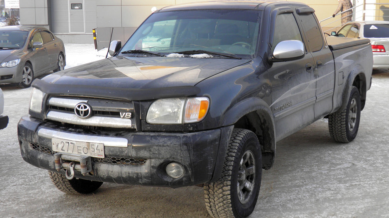A black first-gen Toyota Tundra with a V8 in a Russian parking lot