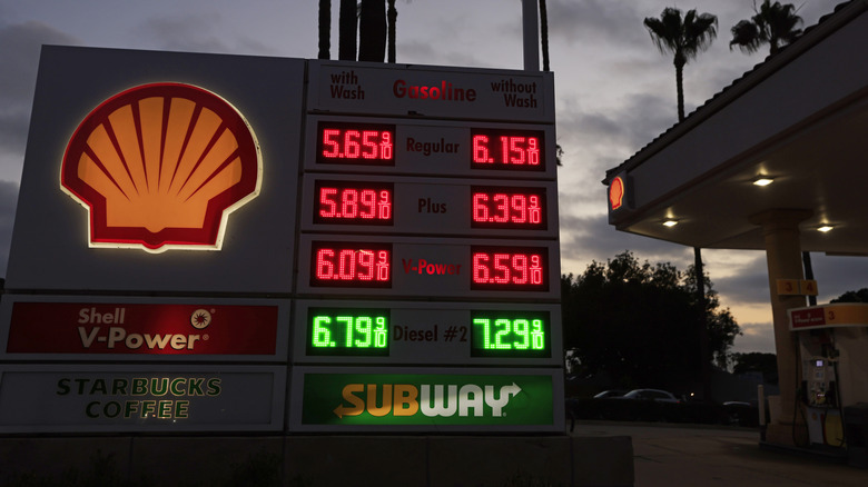 Gas prices listed on the sign for a Shell gas station