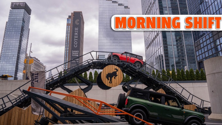 Ford Broncos drive up and down an off-road course made of ramps outside of the New York Javitz Center