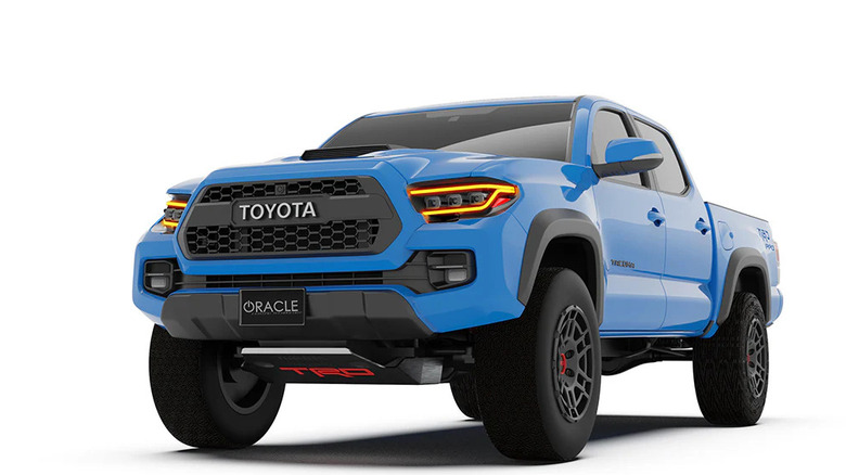 A Toyota Tacoma pickup with Oracle's lensless headlights, shown in front three-quarter view