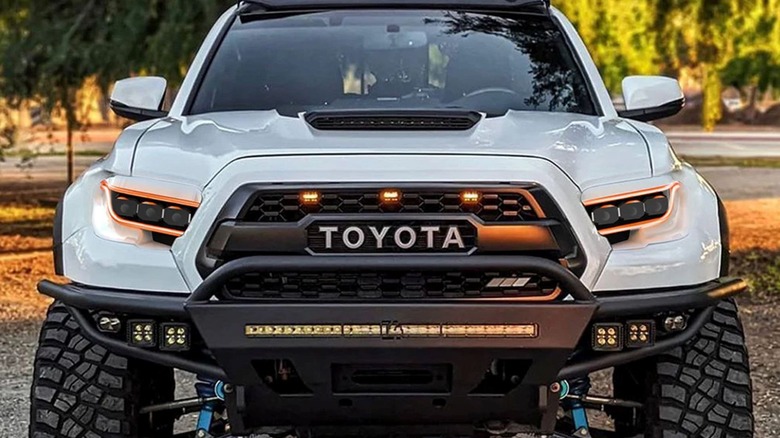 A Toyota Tacoma with Oracle's lensless headlights, seen in a front-on view