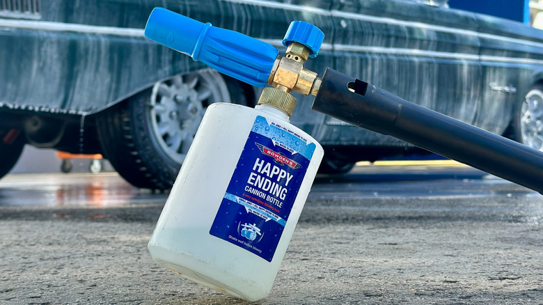 A bottle of Bowden's Own Happy Ending finishing foam attached to a hose.