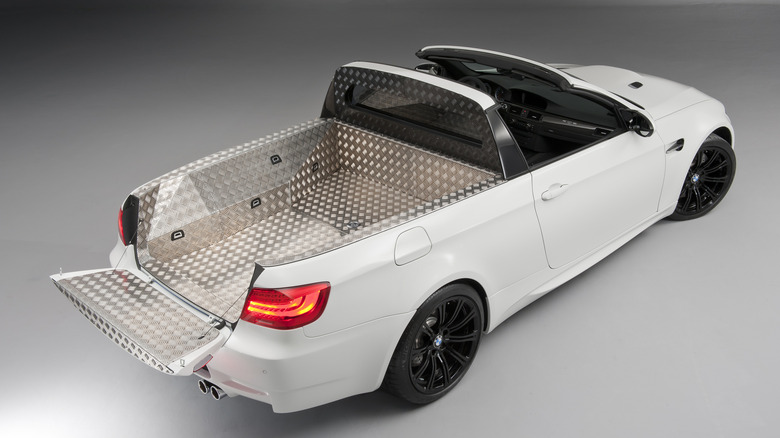 Rear 3/4 view of a white BMW M3 ute