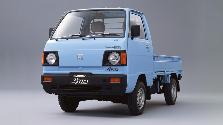 Front 3/4 view of a blue Honda Acty truck