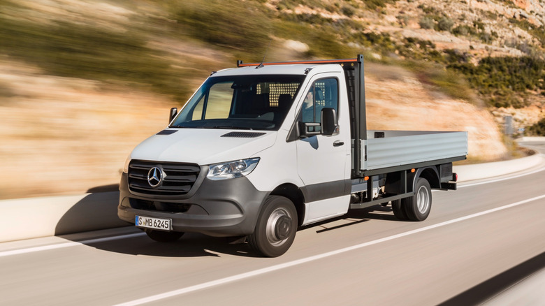 Front 3/4 view of a white Mercedes-Benz Sprinter truck