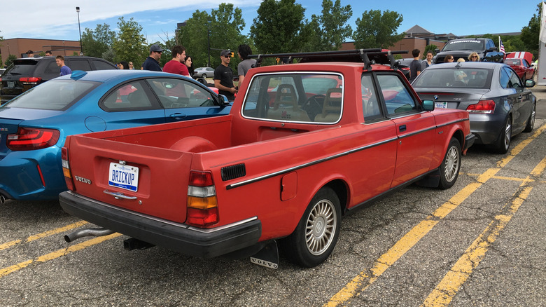 Rear 3/4 view of a red Volvo 240 ute