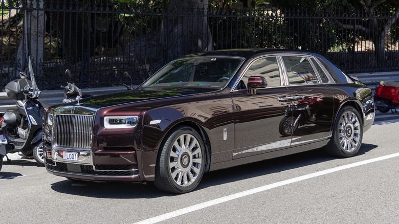 Front 3/4 view of a red Rolls-Royce Phantom