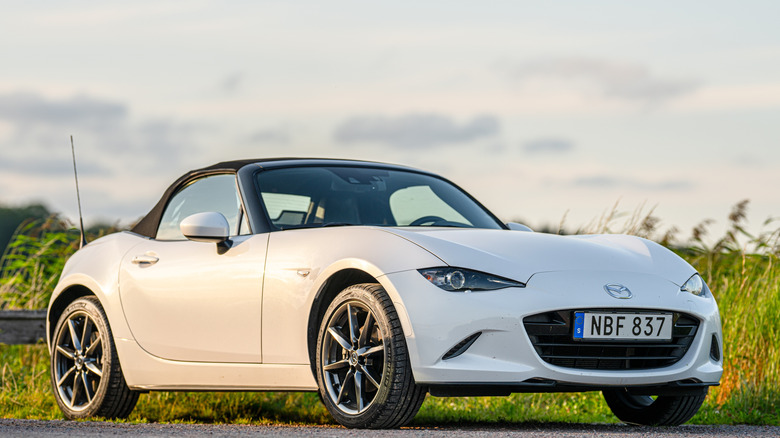Front 3/4 view of a white Mazda Miata