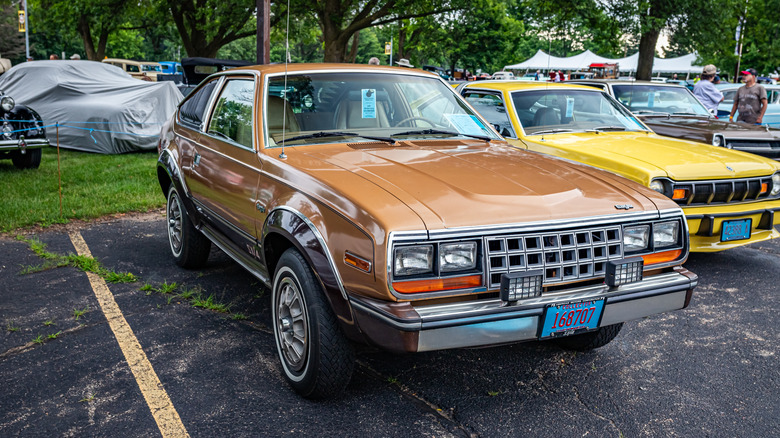A brown AMC Eagle SX4 at a car show