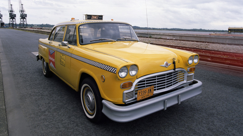 A yellow Checker cab