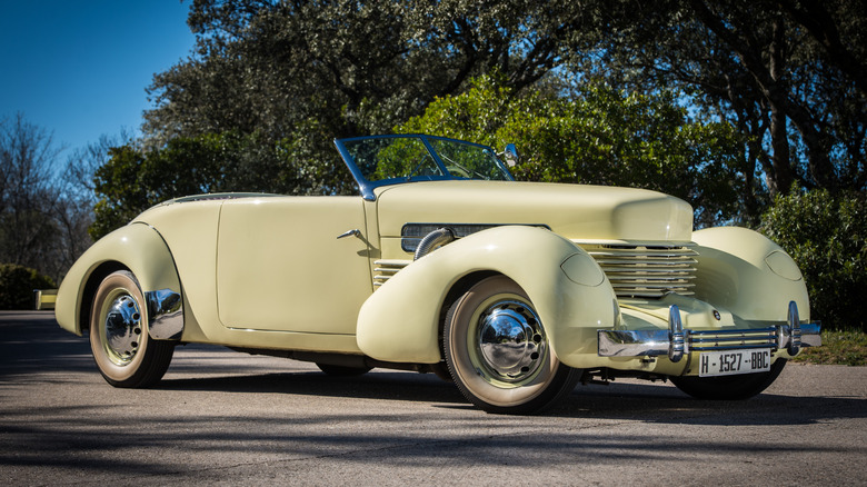 A yellow Cord roadster
