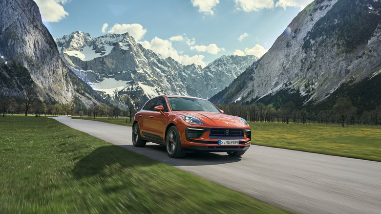 A front 3/4 of 2021 Porsche Macan S driving in mountains