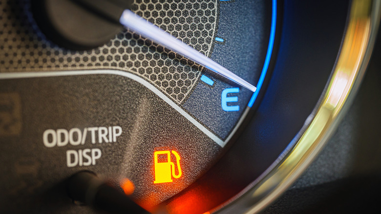 A dashboard light showing the car's fuel tank is empty