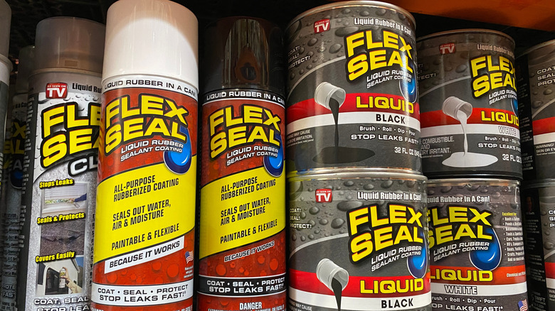 A few cans of Flex Seal waterproofing products at a shelf in Home Depot