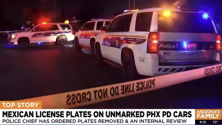 screenshot from the news broadcast showing the TikTok video on a desktop screen zoomed in on the plate of a dark colored Silverado with blue lights in the rear window and a Mexico plate