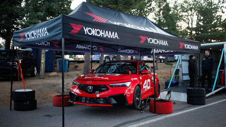 Acura Integra Type S DE5 Pikes Peak sitting under a tent before the race