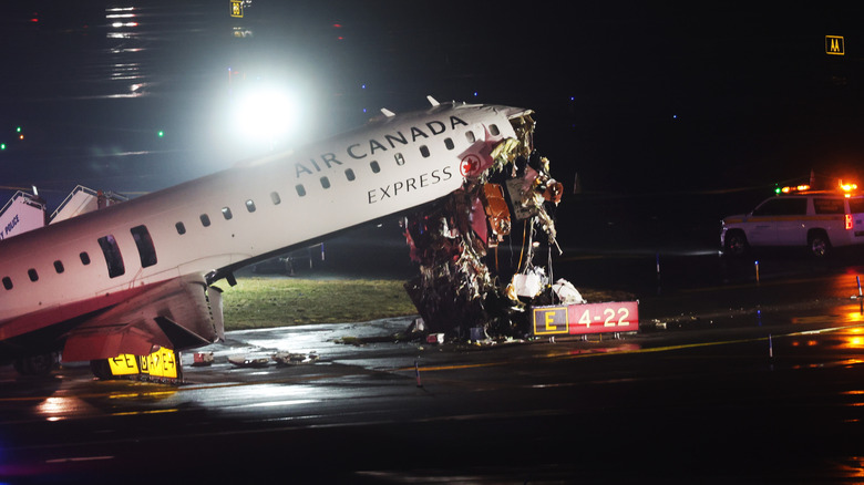 An Air Canada Express plane sits on the tarmac after it collided with a fire truck on the tarmac at LaGuardia Airport on March 23, 2026 in New York City.