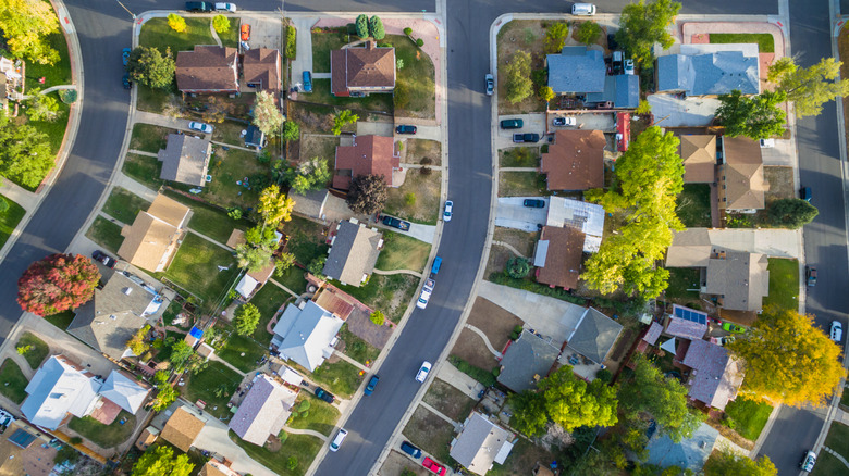 A bird's eye view of a residential neighborhood in autumn.