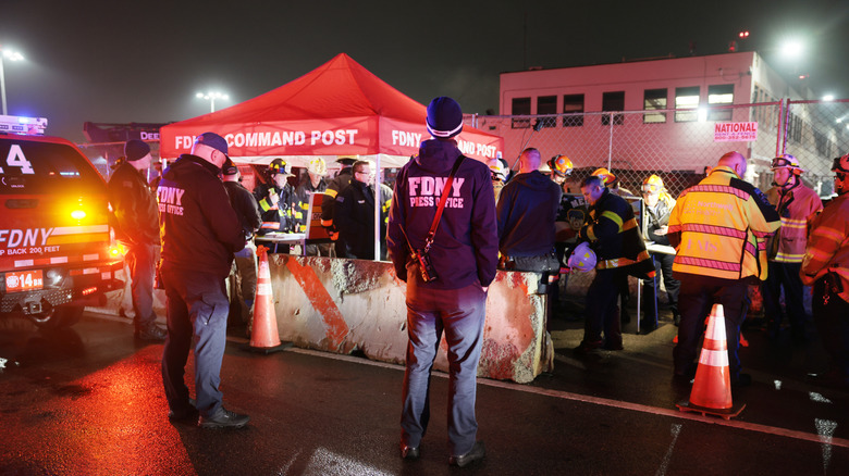 first responders work the scene of the plane crash