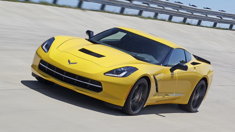 Chevy Corvette driving on a banked racetrack