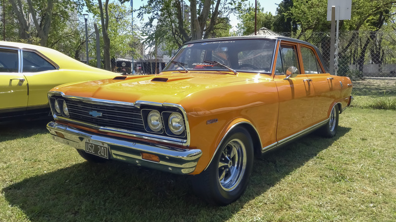 An orange 1969 Pontiac GTO with 400 cubic inch engine