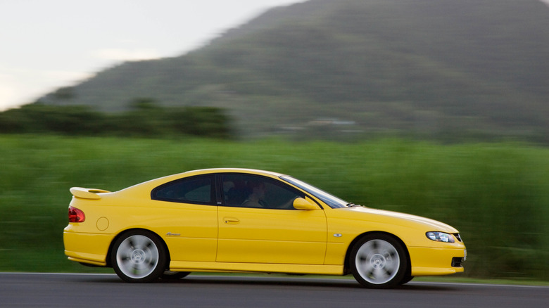 Holden Monaro side profile while driving