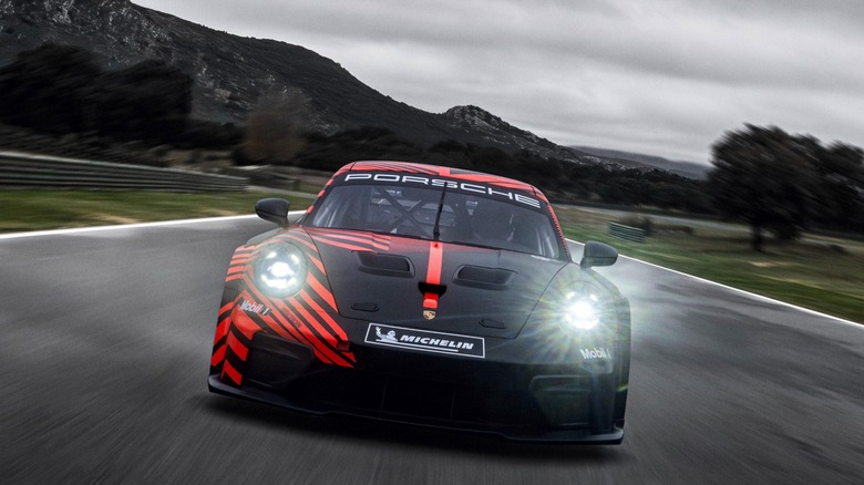 Front view of the Porsche 911 GT4 R on track.