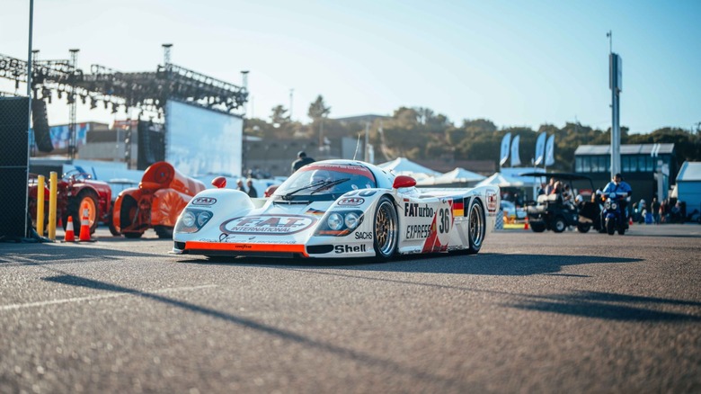 The No. 36 Porsche Dauer 962 drives through the paddock at the Rennsport Reunion at WeatherTech Raceway Laguna Seca in 2023.