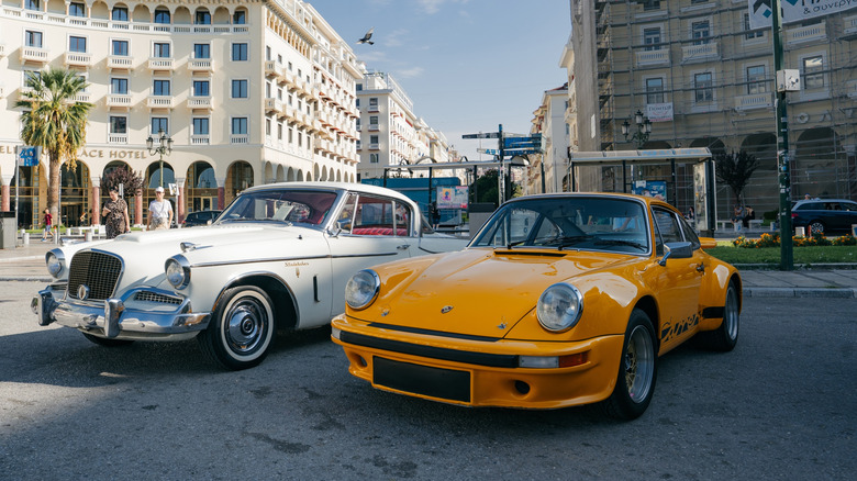 A Studebaker sitting next to a Porsche 911 in 2025.